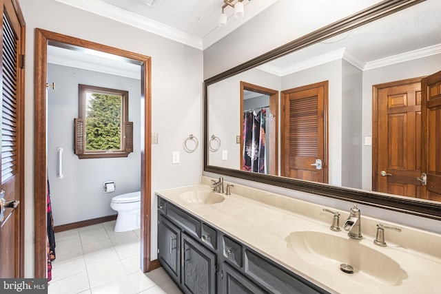 bathroom featuring tile patterned floors, toilet, vanity, and ornamental molding