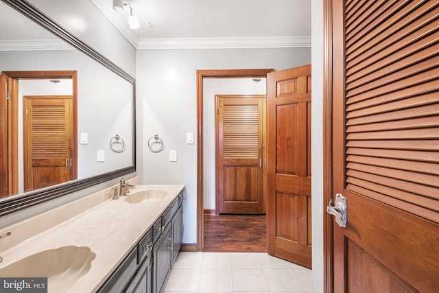 bathroom featuring tile patterned floors, vanity, and crown molding