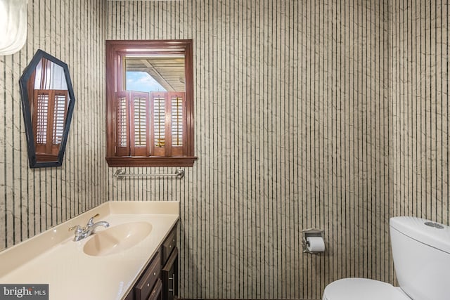 bathroom with vanity and toilet