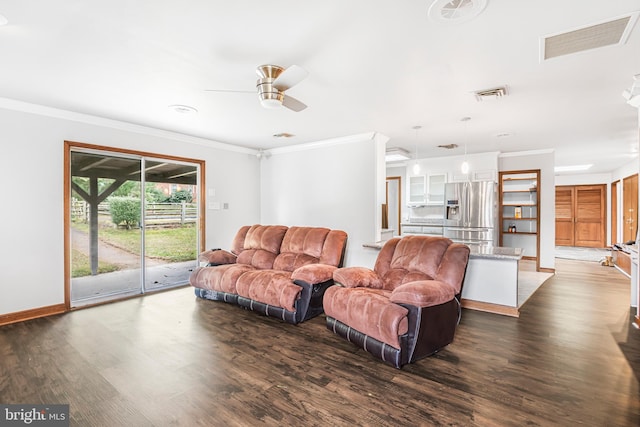 living room with ornamental molding, ceiling fan, and dark wood-type flooring