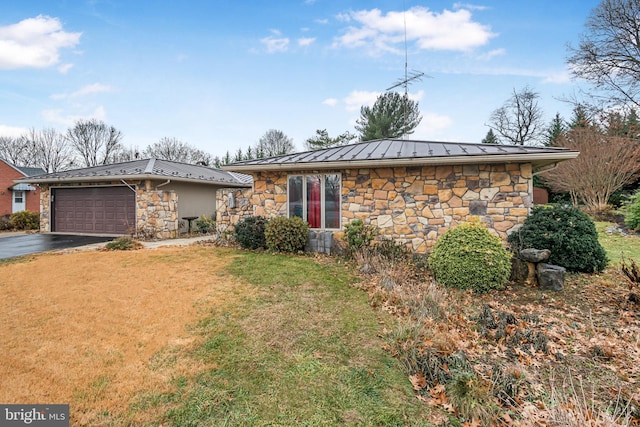 ranch-style house featuring a garage