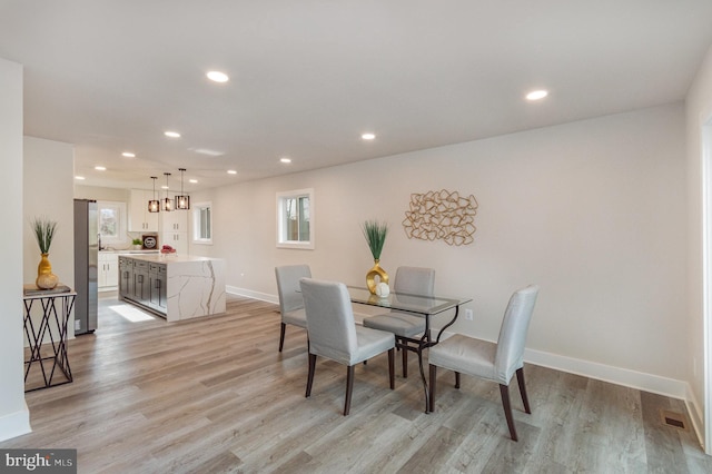 dining area featuring light hardwood / wood-style flooring