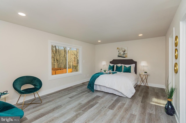 bedroom with hardwood / wood-style floors