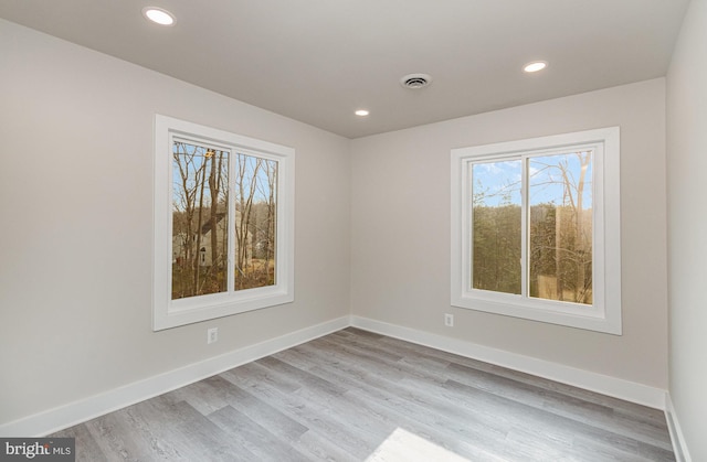 unfurnished room featuring light hardwood / wood-style flooring