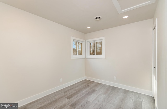 spare room featuring light hardwood / wood-style floors