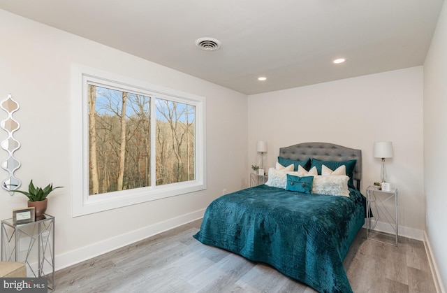 bedroom featuring hardwood / wood-style floors