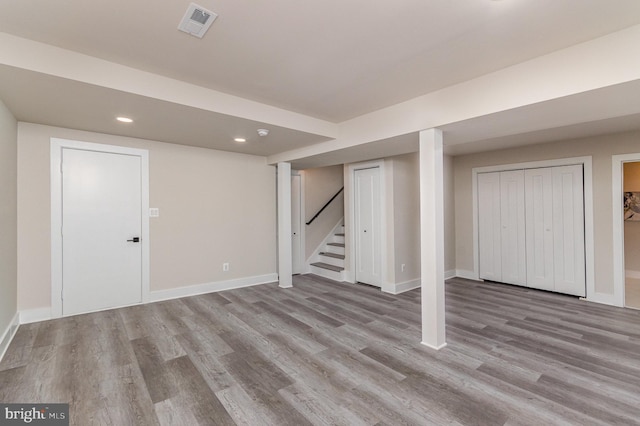 basement featuring light hardwood / wood-style flooring