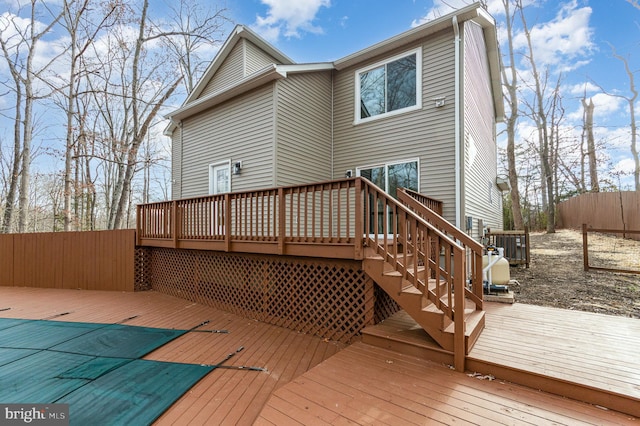 back of house featuring a wooden deck