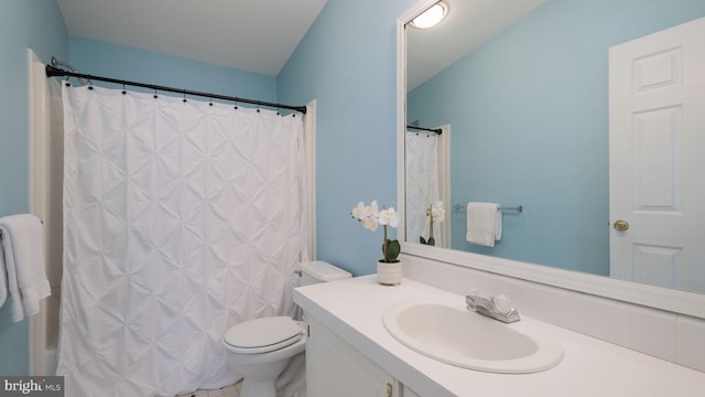 bathroom with vanity and toilet