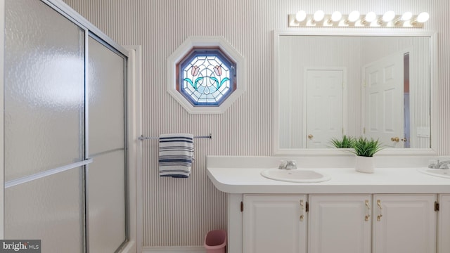 bathroom with vanity and walk in shower