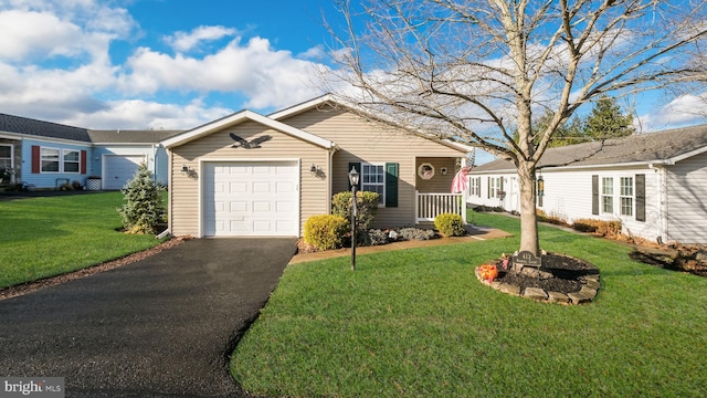 ranch-style house featuring a front lawn and a garage