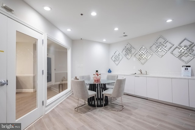 dining space featuring light hardwood / wood-style flooring