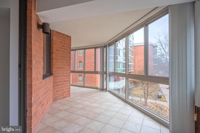 unfurnished sunroom with a wealth of natural light