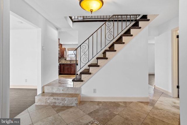 staircase featuring sink