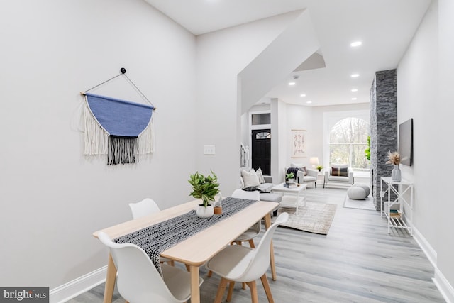 dining area featuring light wood-type flooring