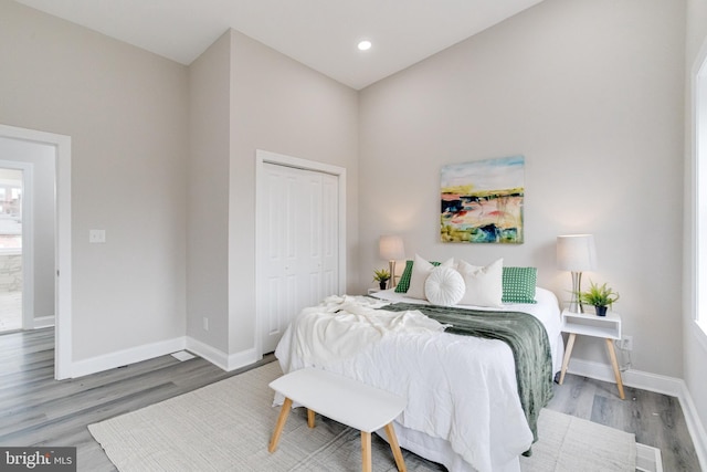 bedroom featuring a closet and hardwood / wood-style flooring