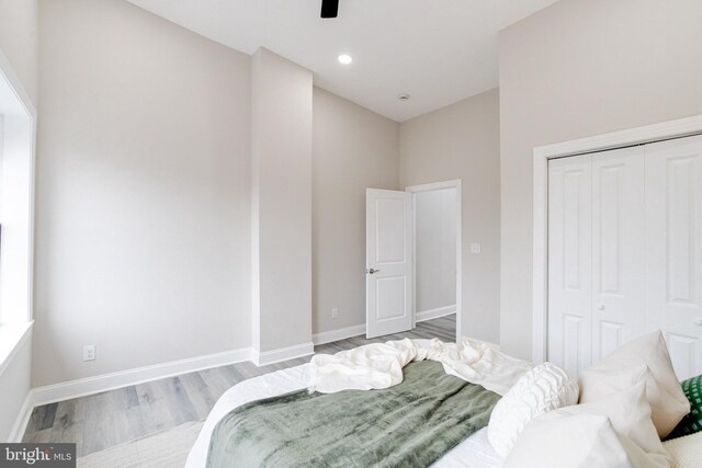 bedroom with hardwood / wood-style flooring and a closet