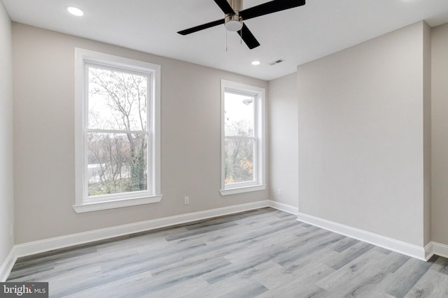 unfurnished room featuring ceiling fan and light hardwood / wood-style flooring