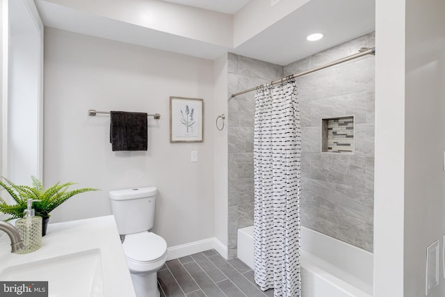 full bathroom with tile patterned floors, vanity, toilet, and shower / bath combo with shower curtain