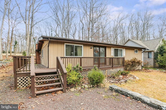 ranch-style house featuring a wooden deck