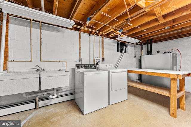 clothes washing area with washer and dryer and sink