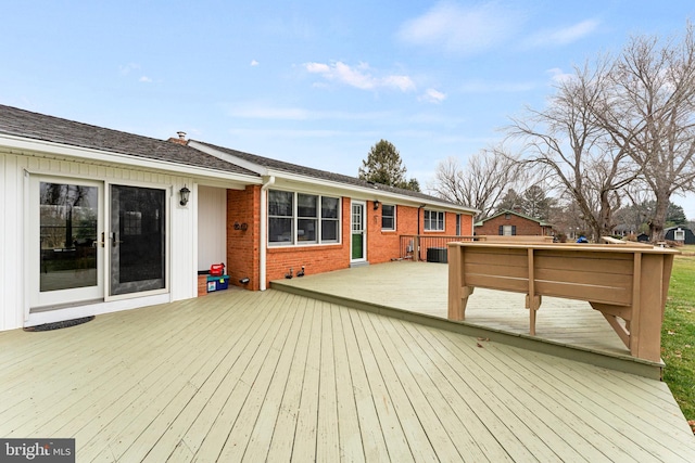 wooden deck with central air condition unit