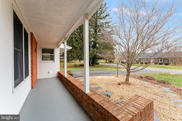 view of patio featuring a porch