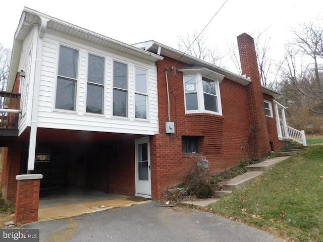 view of side of property with a carport