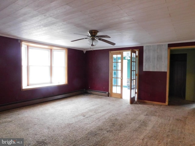 carpeted empty room with ceiling fan, a baseboard heating unit, and french doors