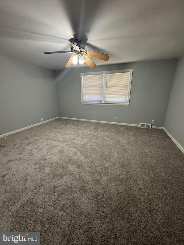 carpeted empty room with ceiling fan