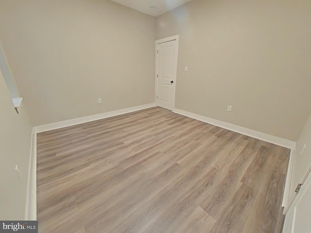 empty room with light wood-type flooring