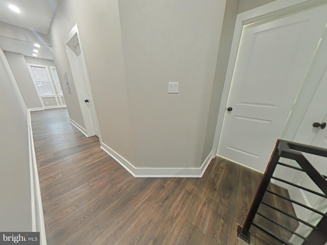 corridor with dark hardwood / wood-style floors