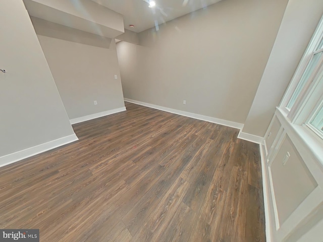 empty room with dark hardwood / wood-style floors