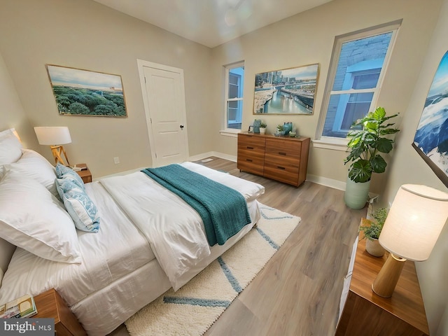 bedroom with light hardwood / wood-style flooring