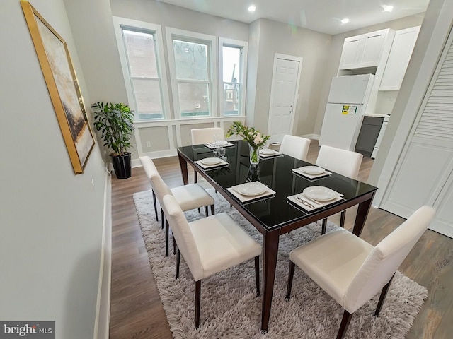 dining area with dark wood-type flooring