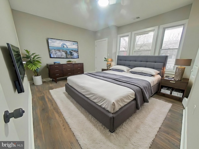 bedroom featuring dark hardwood / wood-style flooring