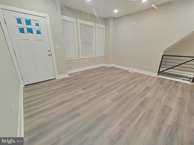 entrance foyer with light hardwood / wood-style flooring