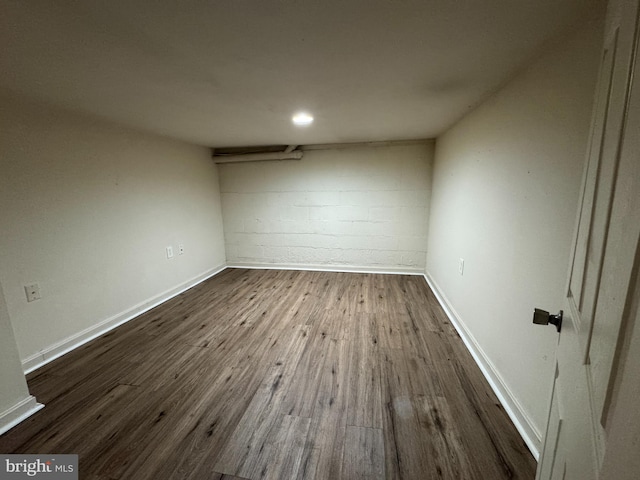 unfurnished room featuring dark hardwood / wood-style flooring