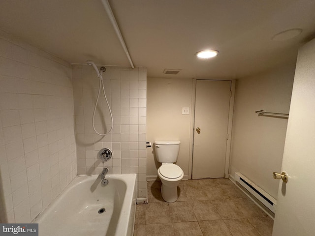 bathroom featuring tile patterned flooring, tiled shower / bath combo, a baseboard radiator, and toilet