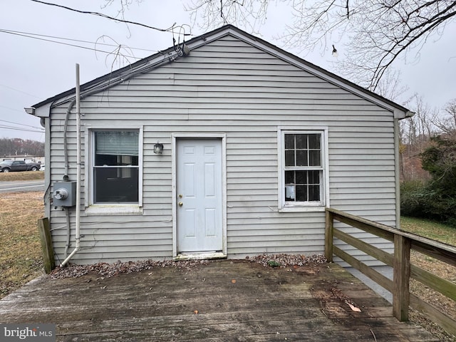 back of house featuring a wooden deck