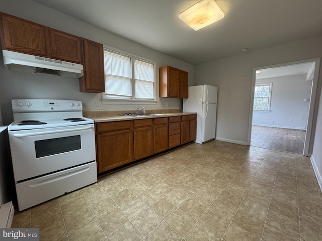 kitchen with white appliances and sink