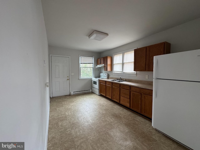 kitchen with sink, a baseboard radiator, and white appliances