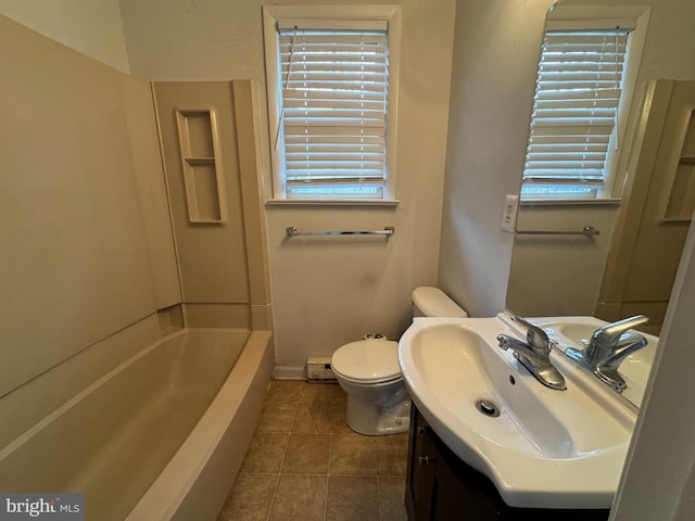 bathroom featuring tile patterned floors, vanity, and toilet