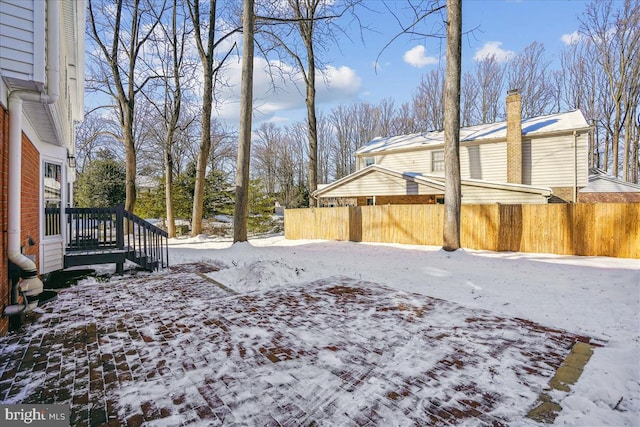 view of yard layered in snow