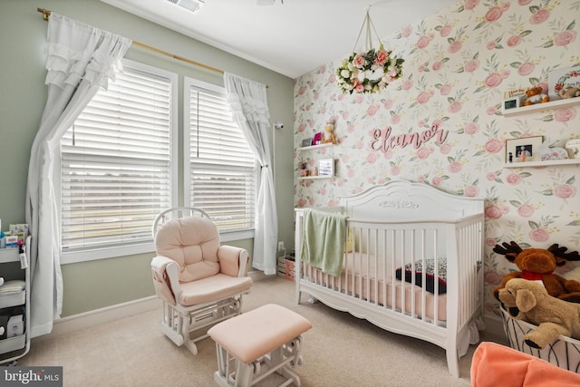 carpeted bedroom with a crib