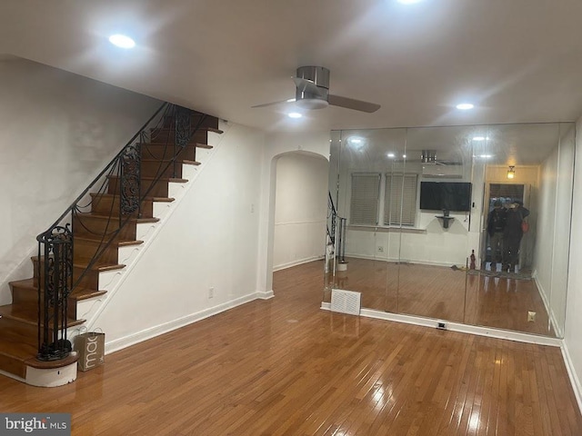 interior space featuring hardwood / wood-style floors and ceiling fan