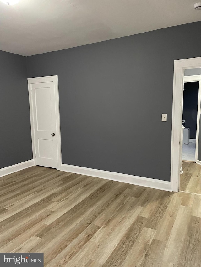 spare room featuring light hardwood / wood-style flooring