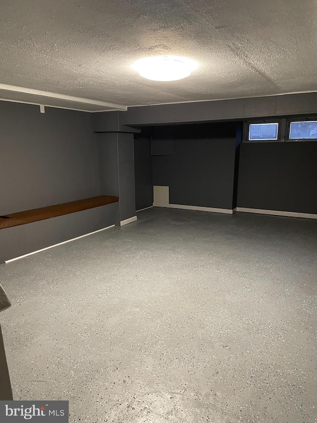 basement with a textured ceiling