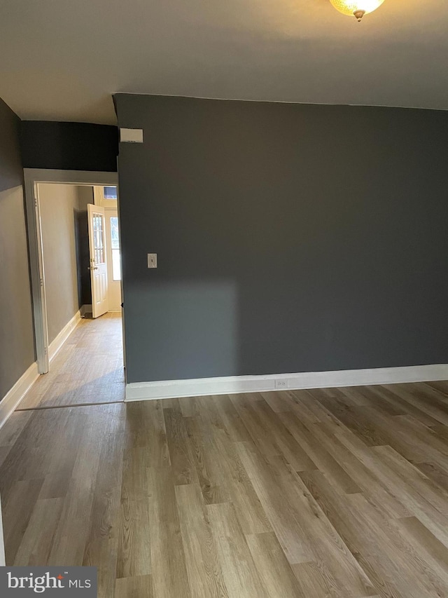 spare room featuring light wood-type flooring