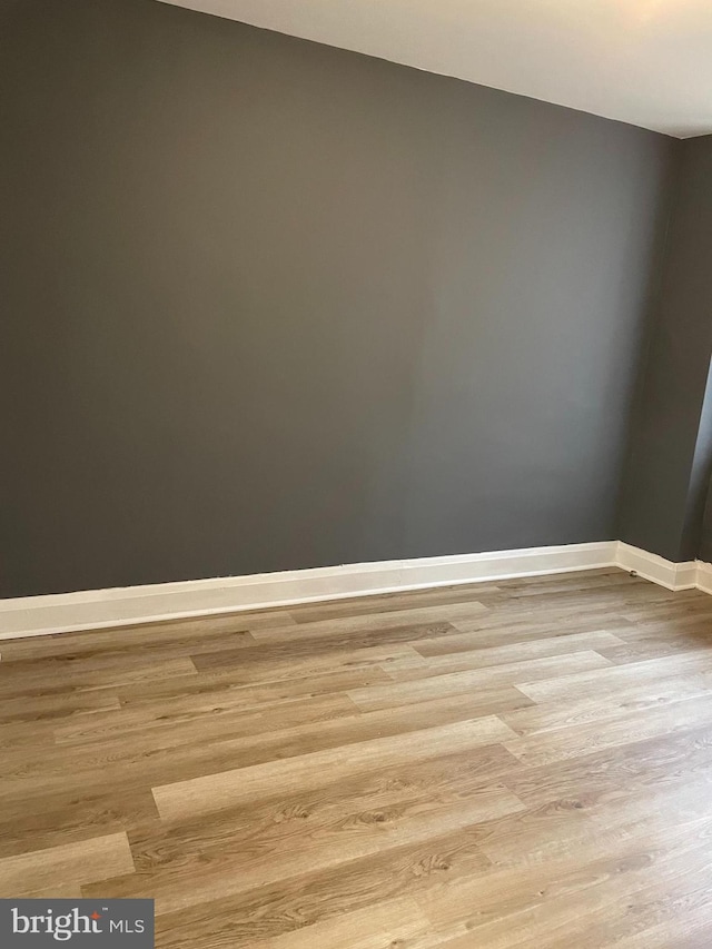 unfurnished room featuring light wood-type flooring